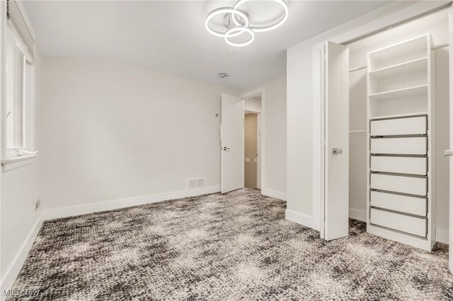 2524 Claver Rd, University Heights, OH 44118 - unfurnished bedroom featuring carpet floors, baseboards, and a closet