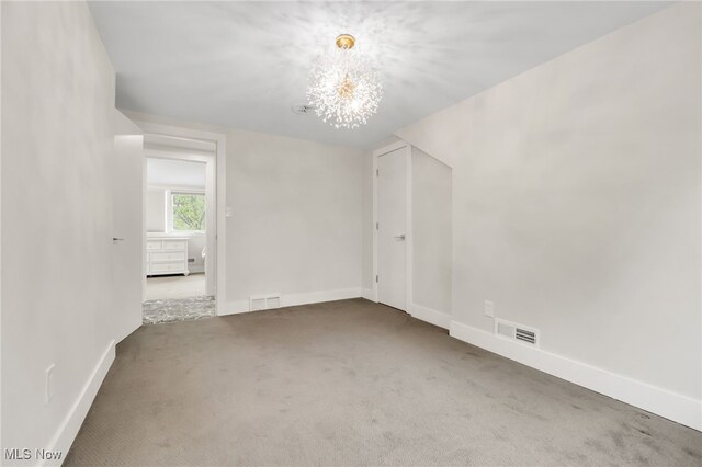 2524 Claver Rd, University Heights, OH 44118 - carpeted spare room featuring a chandelier and baseboards