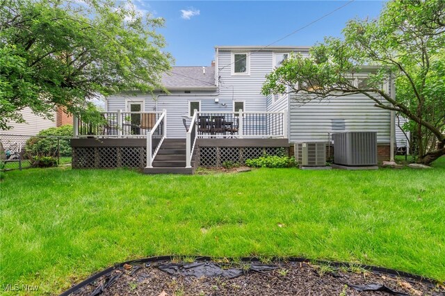 2524 Claver Rd, University Heights, OH 44118 - back of property with central AC, a wooden deck, and a yard