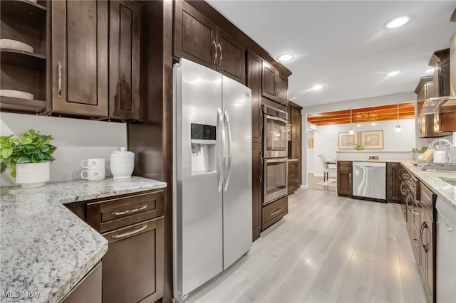 2524 Claver Rd, University Heights, OH 44118 - kitchen with appliances with stainless steel finishes, dark brown cabinetry, light wood-style floors, open shelves, and recessed lighting