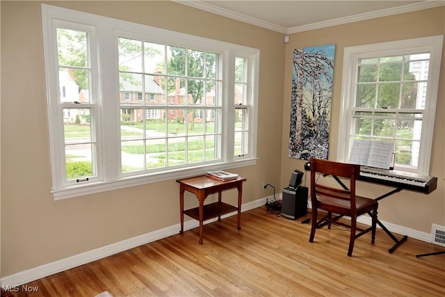 2323 Miramar Blvd, University Heights, OH 44118 - sitting room with baseboards, healthy amount of natural light, light wood-style flooring, and crown molding