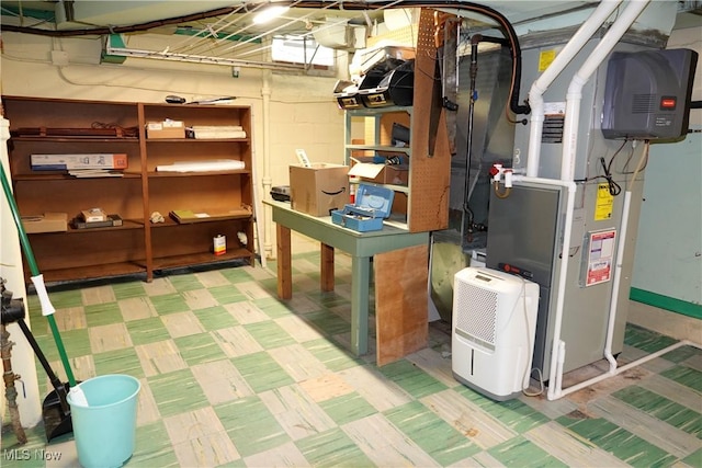 2323 Miramar Blvd, University Heights, OH 44118 - unfinished basement with tile patterned floors and heating unit