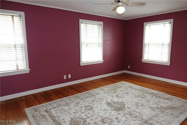 2323 Miramar Blvd, University Heights, OH 44118 - empty room with wood finished floors, healthy amount of natural light, baseboards, and ornamental molding
