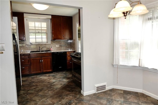 2323 Miramar Blvd, University Heights, OH 44118 - kitchen with dishwasher, gas range, a sink, stone finish flooring, and baseboards