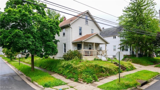 1197 Carey Ave, Akron, OH 44314 - view of front of home with covered porch