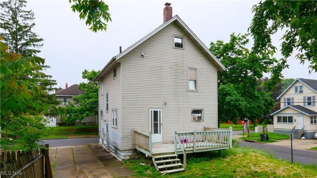 1197 Carey Ave, Akron, OH 44314 - rear view of property with a wooden deck, a chimney, and cooling unit