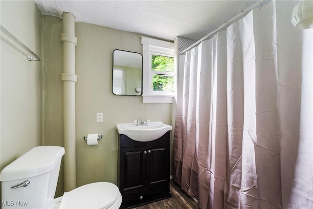 492 W Pershing St, Salem, OH 44460 - bathroom featuring toilet, vanity, a shower with curtain, and wood finished floors