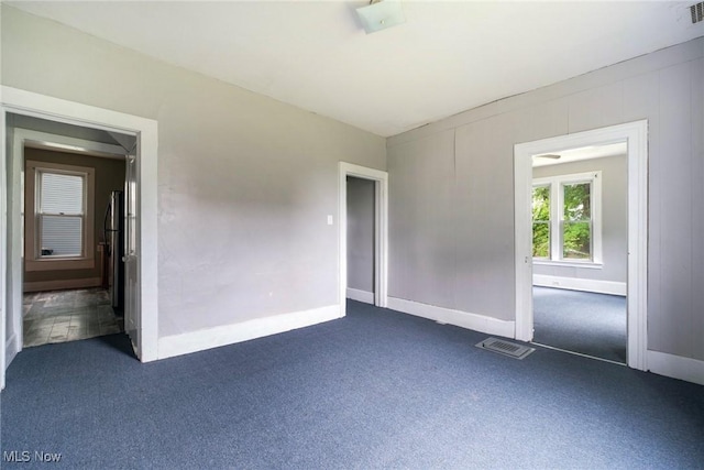 492 W Pershing St, Salem, OH 44460 - unfurnished room featuring dark carpet and baseboards