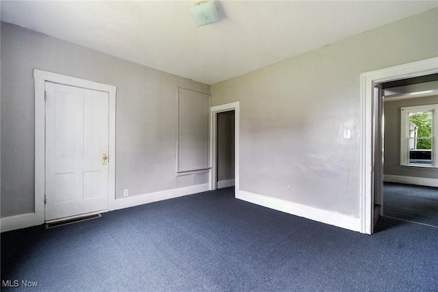 492 W Pershing St, Salem, OH 44460 - unfurnished room featuring dark colored carpet and baseboards