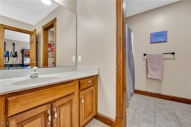 1271 Emerald Creek Dr, Broadview Heights, OH 44147 - bathroom with vanity, baseboards, tile patterned floors, and a shower with shower curtain