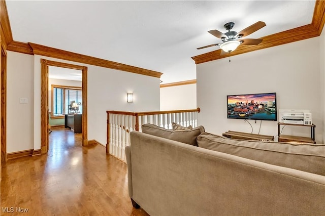 1271 Emerald Creek Dr, Broadview Heights, OH 44147 - living area featuring crown molding, ceiling fan, wood finished floors, and baseboards