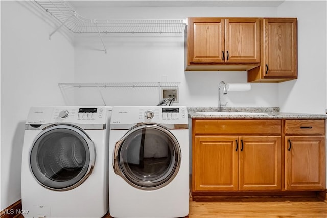 1271 Emerald Creek Dr, Broadview Heights, OH 44147 - laundry area with cabinet space, light wood finished floors, and washing machine and dryer