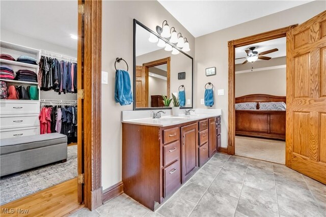 1271 Emerald Creek Dr, Broadview Heights, OH 44147 - full bathroom featuring ensuite bath, double vanity, a ceiling fan, a walk in closet, and baseboards
