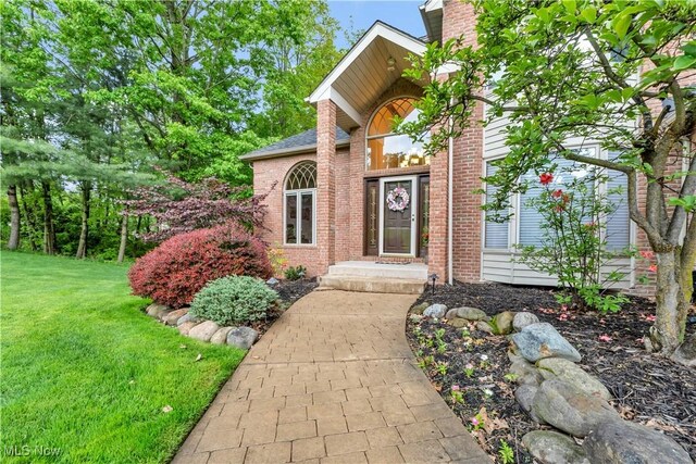 1271 Emerald Creek Dr, Broadview Heights, OH 44147 - doorway to property featuring a yard, brick siding, and a chimney