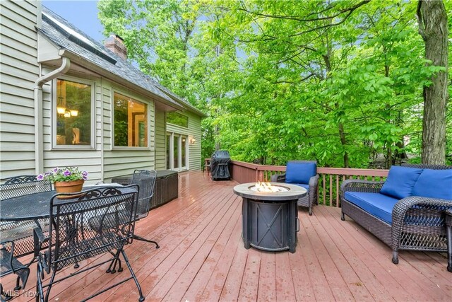 1271 Emerald Creek Dr, Broadview Heights, OH 44147 - wooden deck featuring an outdoor fire pit, area for grilling, and outdoor dining area