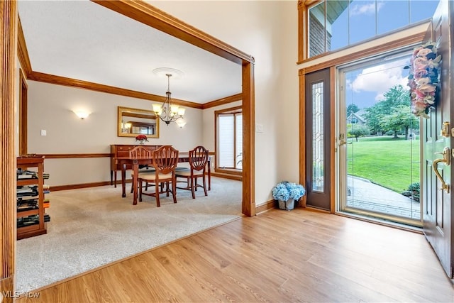 1271 Emerald Creek Dr, Broadview Heights, OH 44147 - foyer entrance featuring a chandelier, ornamental molding, wood finished floors, and baseboards