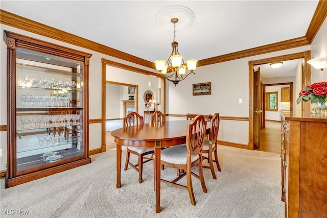 1271 Emerald Creek Dr, Broadview Heights, OH 44147 - dining room featuring crown molding, a chandelier, light colored carpet, and baseboards