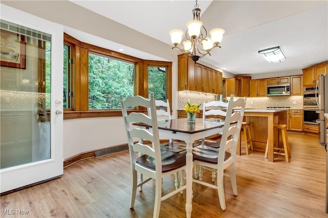 1271 Emerald Creek Dr, Broadview Heights, OH 44147 - dining room featuring light wood-style floors, a chandelier, and baseboards