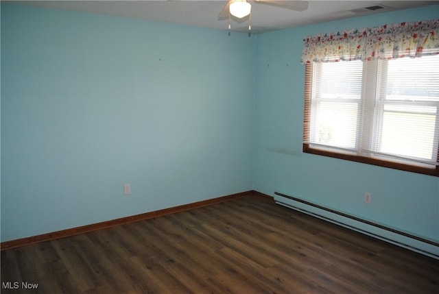 13350 Baumhart Rd, Amherst, OH 44001 - empty room with a baseboard heating unit, wood finished floors, a ceiling fan, and baseboards