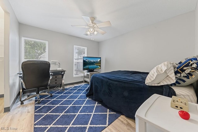 319 Sterling Ct, Akron, OH 44304 - bedroom with wood finished floors, ceiling fan, and a desk