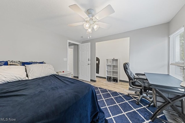 319 Sterling Ct, Akron, OH 44304 - bedroom featuring wood finished floors, a desk, and a ceiling fan