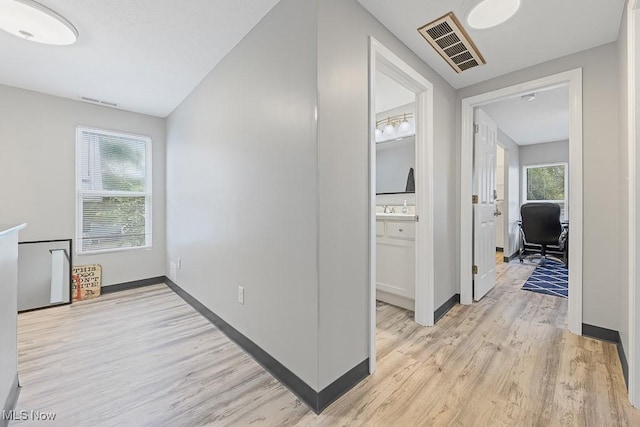 319 Sterling Ct, Akron, OH 44304 - hallway with light wood finished floors and an office area