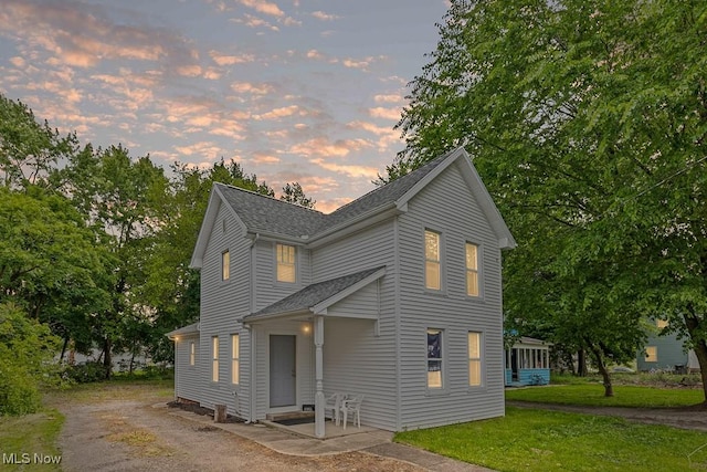 319 Sterling Ct, Akron, OH 44304 - view of front of house featuring a lawn and a shingled roof