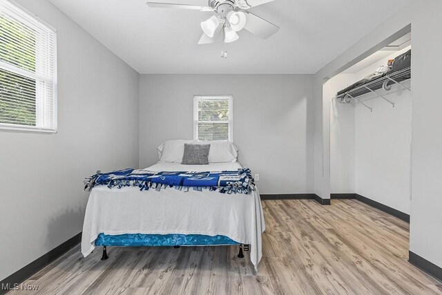 319 Sterling Ct, Akron, OH 44304 - bedroom with wood finished floors and ceiling fan