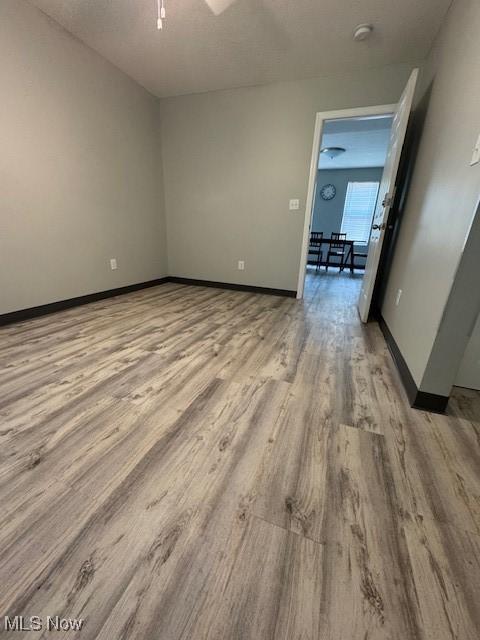 319 Sterling Ct, Akron, OH 44304 - unfurnished room with wood finished floors and ceiling fan