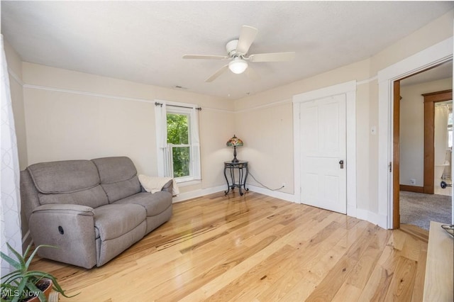 201 E Spring St, Marietta, OH 45750 - sitting room with light wood finished floors, ceiling fan, and baseboards