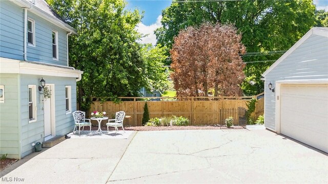 201 E Spring St, Marietta, OH 45750 - view of patio / terrace with a garage