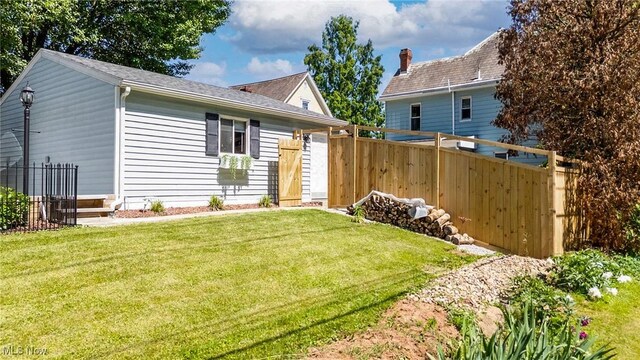 201 E Spring St, Marietta, OH 45750 - rear view of property featuring roof with shingles