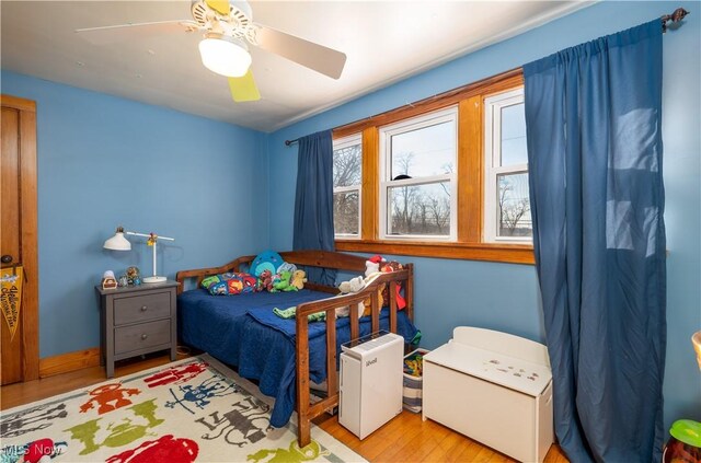 7084 Germano SE, Carrollton, OH 44615 - bedroom with wood finished floors and a ceiling fan