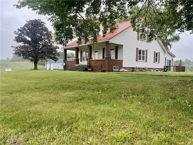 7084 Germano SE, Carrollton, OH 44615 - view of front of house featuring covered porch and a front lawn