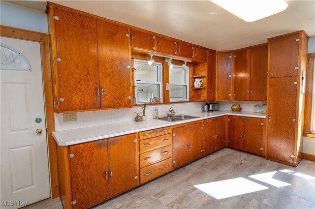 7084 Germano SE, Carrollton, OH 44615 - kitchen featuring a sink, brown cabinets, and light countertops
