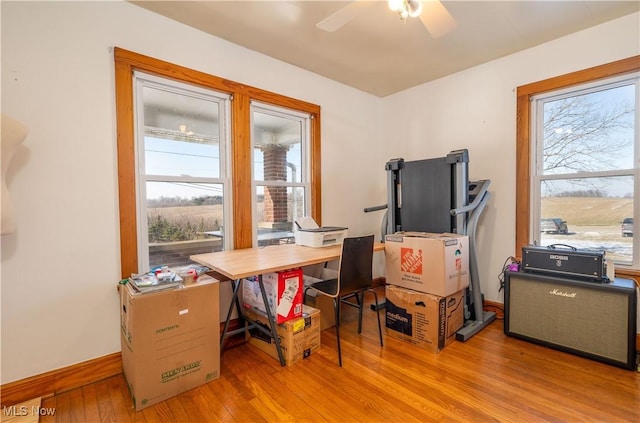 7084 Germano SE, Carrollton, OH 44615 - office area featuring plenty of natural light, light wood-style floors, a ceiling fan, and baseboards
