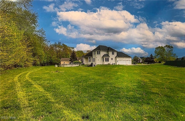 6419 S Rim Cir, Valley City, OH 44280 - back of house featuring a yard and an attached garage