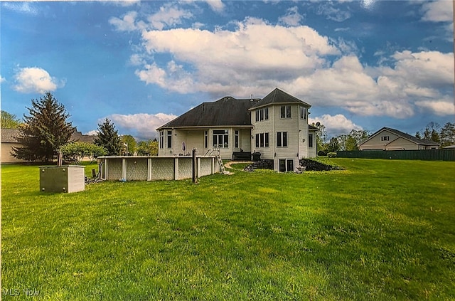 6419 S Rim Cir, Valley City, OH 44280 - back of property with a lawn and a swimming pool