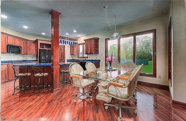 6419 S Rim Cir, Valley City, OH 44280 - dining area featuring baseboards, a textured ceiling, dark wood-type flooring, ornate columns, and recessed lighting