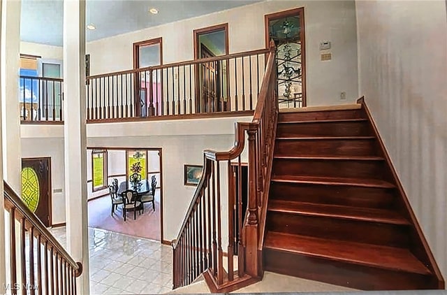 6419 S Rim Cir, Valley City, OH 44280 - staircase with plenty of natural light, baseboards, and tile patterned floors