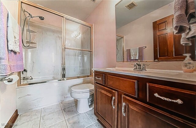 6419 S Rim Cir, Valley City, OH 44280 - bathroom with toilet, vanity, and bath / shower combo with glass door
