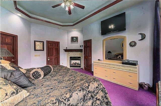 6419 S Rim Cir, Valley City, OH 44280 - bedroom featuring carpet floors, a fireplace, a raised ceiling, ceiling fan, and ornamental molding