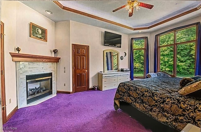 6419 S Rim Cir, Valley City, OH 44280 - bedroom with ornamental molding, a raised ceiling, carpet flooring, baseboards, and a fireplace