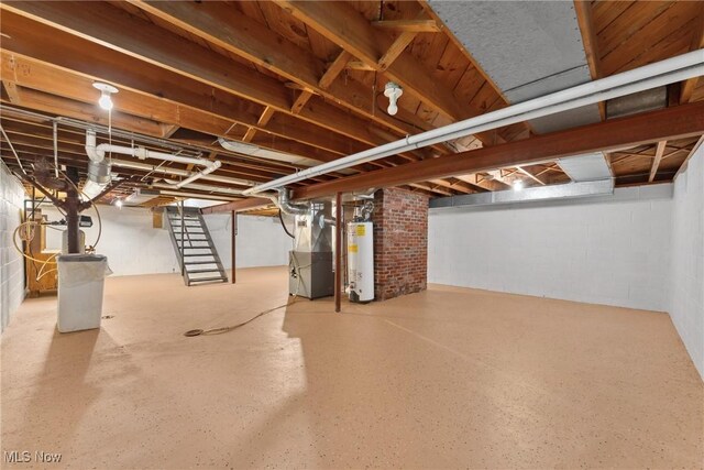 6525 Wales Ave NW, Massillon, OH 44646 - unfinished below grade area featuring heating unit, gas water heater, stairway, and concrete block wall
