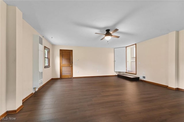 6525 Wales Ave NW, Massillon, OH 44646 - spare room featuring a ceiling fan, hardwood / wood-style floors, and baseboards