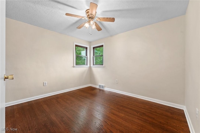 6525 Wales Ave NW, Massillon, OH 44646 - empty room with wood finished floors, baseboards, a ceiling fan, and a textured ceiling