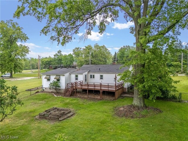 6525 Wales Ave NW, Massillon, OH 44646 - rear view of property with a deck, view of scattered trees, and crawl space
