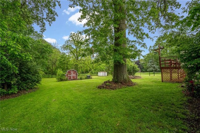 6525 Wales Ave NW, Massillon, OH 44646 - view of grassy yard with a deck