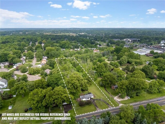 6525 Wales Ave NW, Massillon, OH 44646 - aerial view of property and surrounding area featuring property boundaries highlighted and a forest