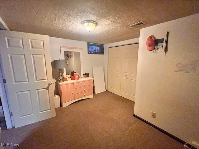 76 Parkgate Ave, Youngstown, OH 44515 - bedroom featuring dark colored carpet, a closet, and a textured ceiling